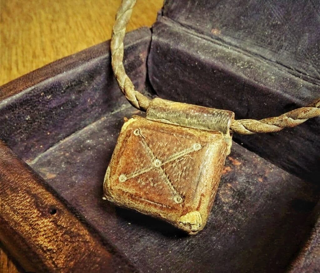 West African protective amulets gris-gris leather pouch carried by traders for financial protection