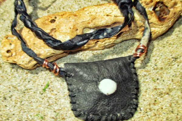 West African protective amulets gris-gris leather pouch carried by traders for financial protection