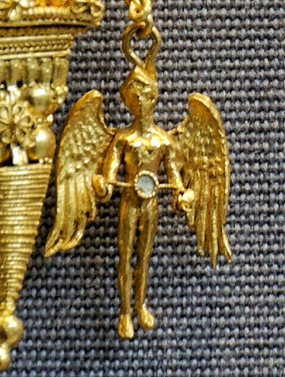 sacred object irresistible Iynx ancient Greek spinning wheel love magic Aphrodite artifact