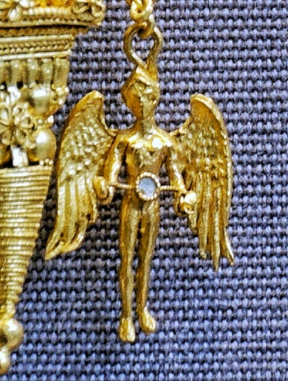 sacred object irresistible Iynx ancient Greek spinning wheel love magic Aphrodite artifact