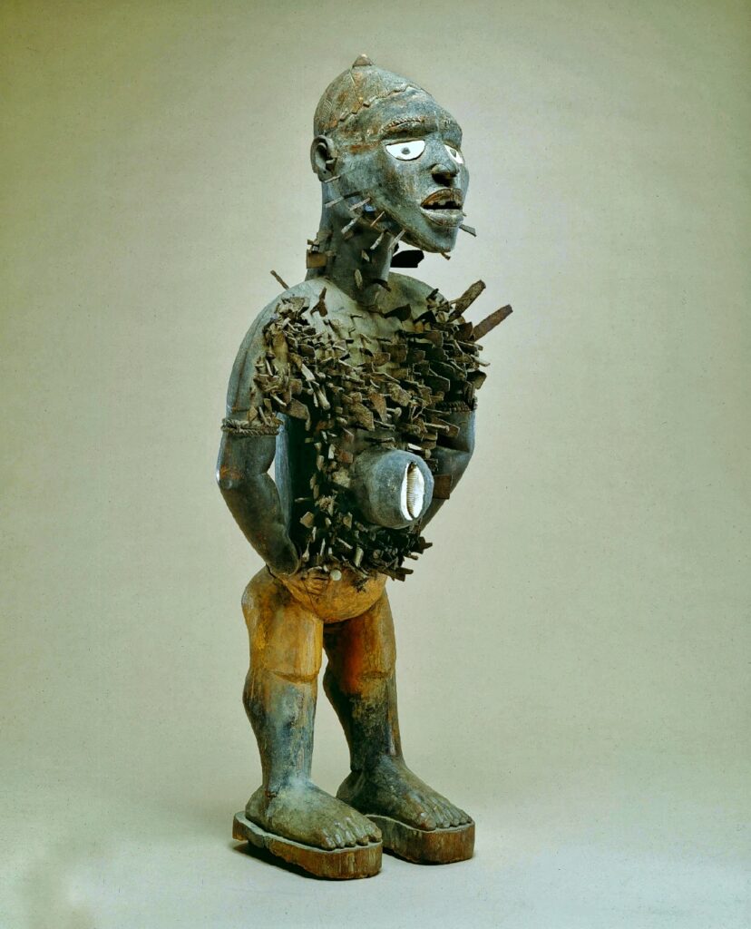 Nkisi Nkondi power figure from the Kongo people of Central Africa covered in iron nails and blades