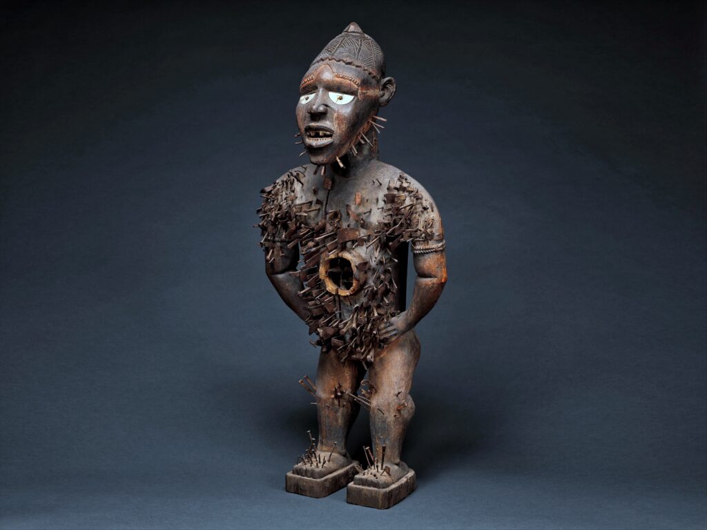 Nkisi Nkondi power figure from the Kongo people of Central Africa covered in iron nails and blades