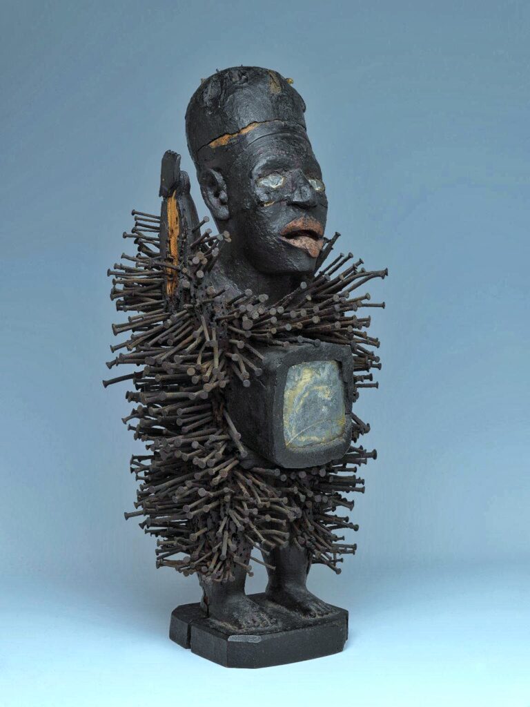 Nkisi Nkondi power figure from the Kongo people of Central Africa covered in iron nails and blades